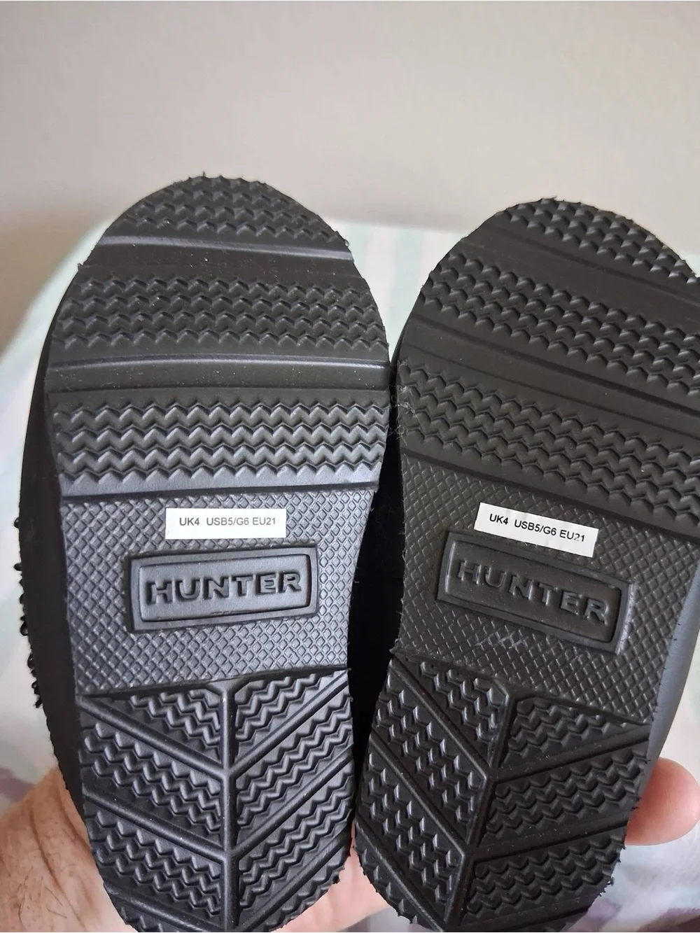 Hunter Kids Black Sherpa Slip-Ons with Red Logo Tab